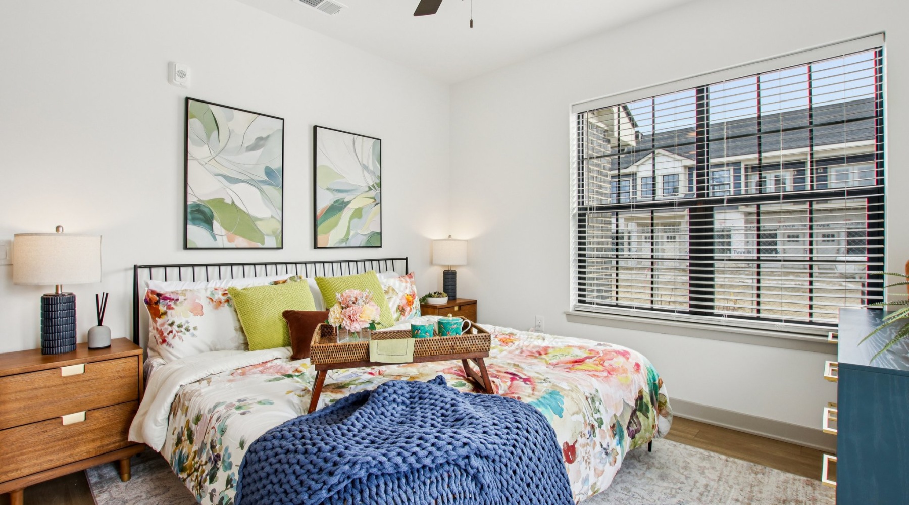 Styled apartment bedroom with floral accents