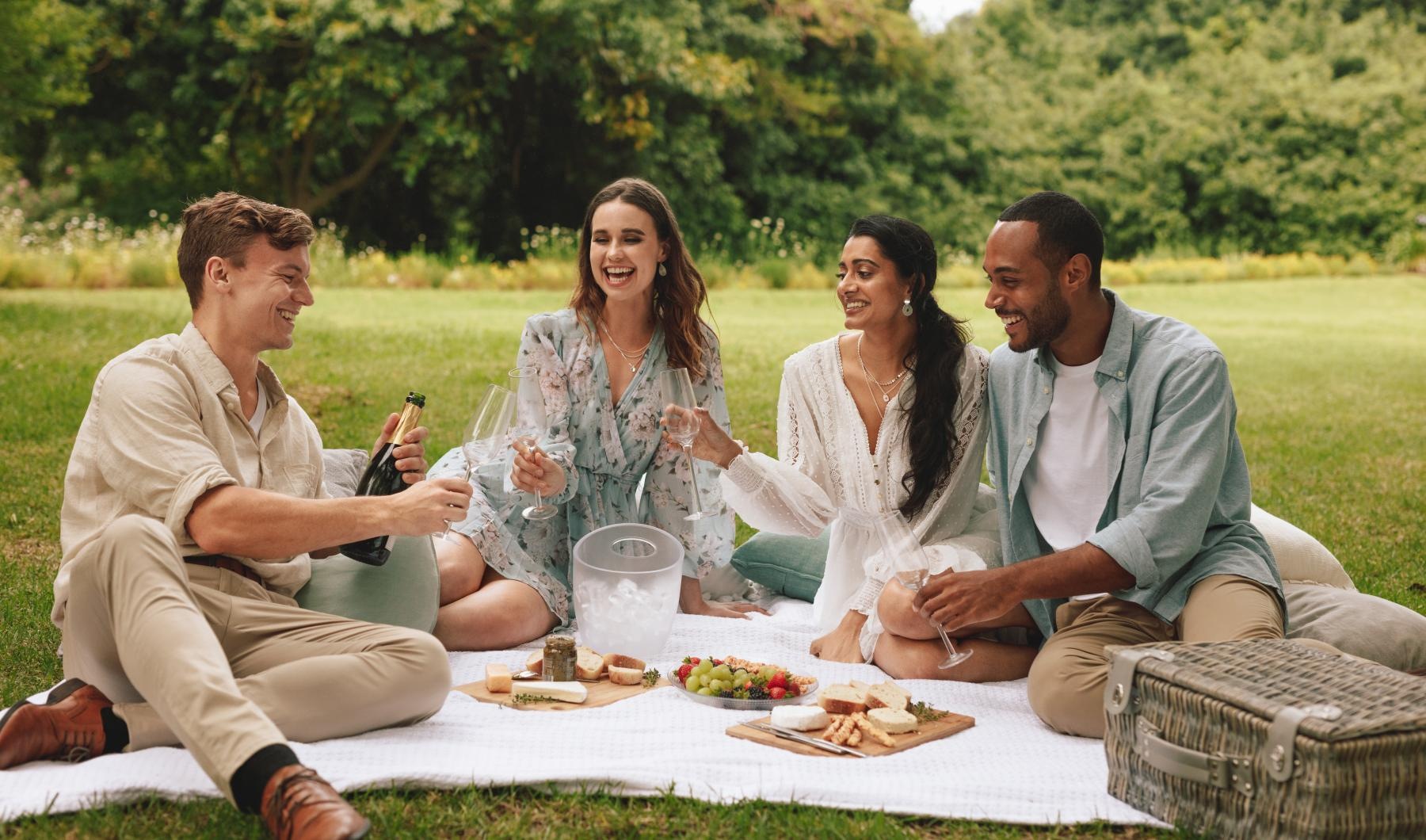 a group of people sitting on a picnic table