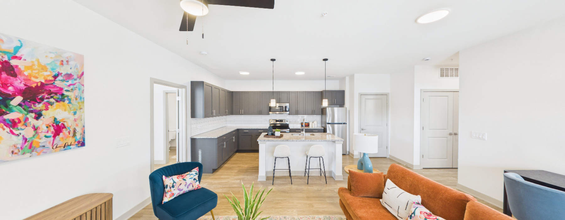 Styled living room with view of kitchen