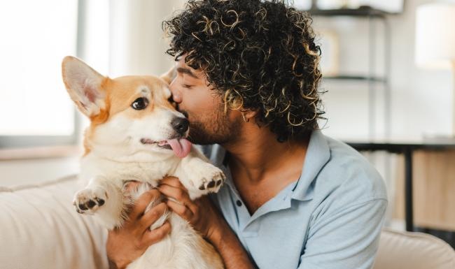 a man holding a dog